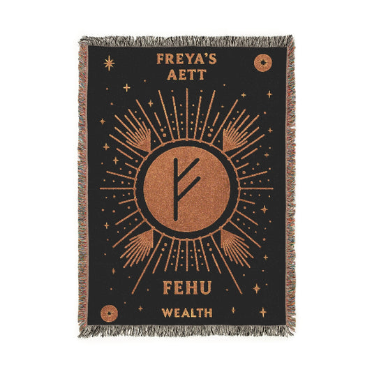 Woven blanket with sun design and Fehu wealth symbol on a black background